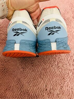 Reebok Woman’s Training Shoes - White, Light Blue & Orange Accents- fits 9/ 9.5